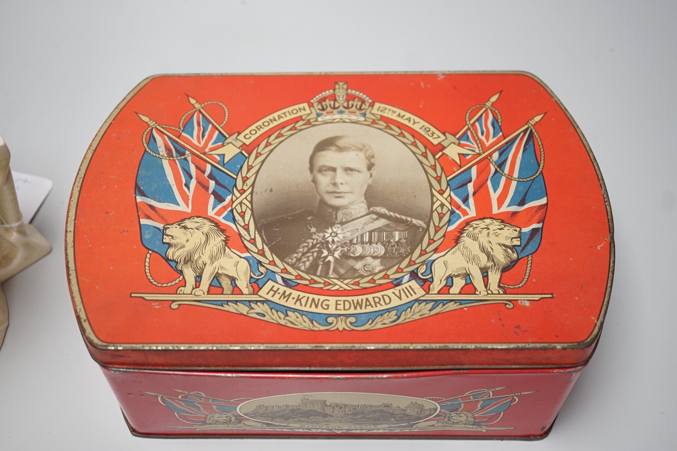 A musical Edward VII Coronation jug playing ' God save the King' and an Edward VIII biscuit tin